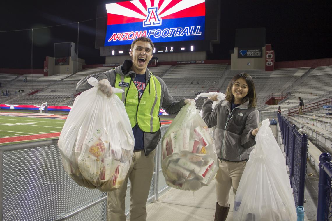 Students for Sustainability members Michael Rabbani and Stephanie Choi collect bags of compostable items after Arizona's win against Utah on Nov. 14. Students for Sustainability members Michael Rabbani and Stephanie Choi collect bags of compostable items after Arizona's win against Utah on Nov. 14.