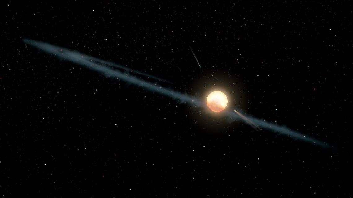 This illustration depicts a hypothetical uneven ring of dust orbiting KIC 8462852, also known as Boyajian’s Star or Tabby's Star. Astronomers have found the dimming of the star over long periods appears to be weaker at longer infrared wavelengths of light This illustration depicts a hypothetical uneven ring of dust orbiting KIC 8462852, also known as Boyajian’s Star or Tabby's Star. Astronomers have found the dimming of the star over long periods appears to be weaker at longer infrared wavelengths of light