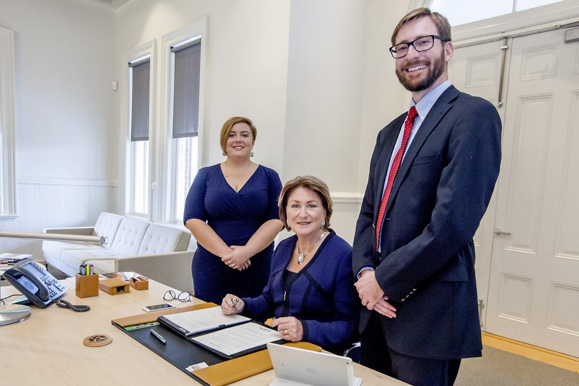 UA President Ann Weaver Hart signs the sustainability agreement with ASUA senator Maddy Bynes  and Ben Champion, director of the UA Office of Sustainability, on hand.  