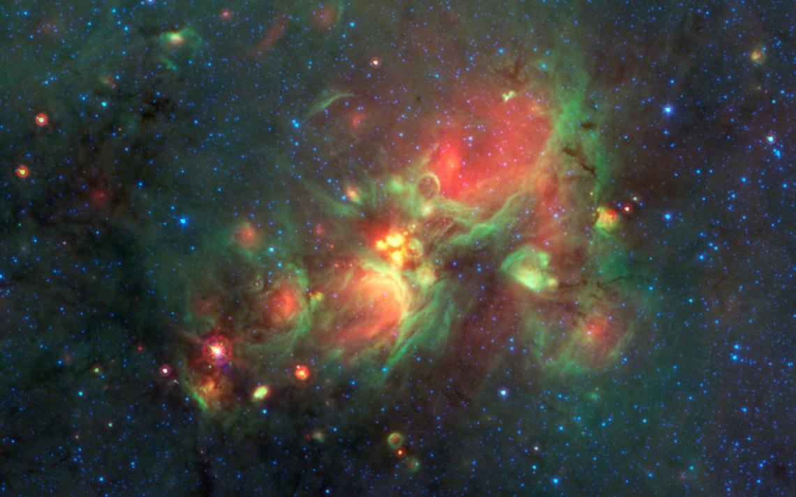 The yellow balls seen at the center of this image are a phase of massive star formation that comes before the massive stars have cleared cavities in the clouds of gas around them but after the cold, collapsing gas stage that Jenny Calahan and Yancy Shirl The yellow balls seen at the center of this image are a phase of massive star formation that comes before the massive stars have cleared cavities in the clouds of gas around them but after the cold, collapsing gas stage that Jenny Calahan and Yancy Shirl