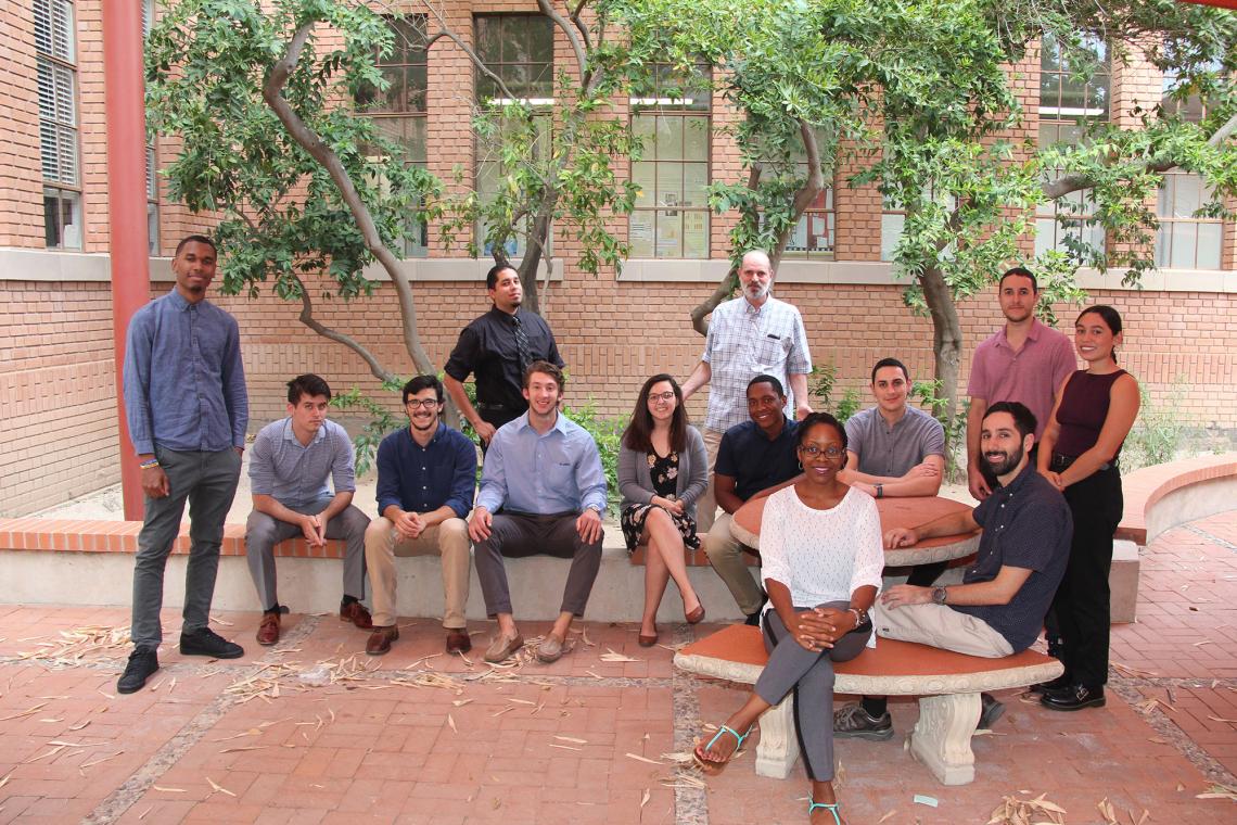 The current Bridge to Doctorate cohort students, with UA faculty and staff. Back row, left to right: Terrance DeLisser, Zachary Binger, Joseph Moya, Samuel Cabral, Nathan Reiland, Erica Vanover, UA professor Jim Field, Pierce Longmire, Joseph Agosttini, J The current Bridge to Doctorate cohort students, with UA faculty and staff. Back row, left to right: Terrance DeLisser, Zachary Binger, Joseph Moya, Samuel Cabral, Nathan Reiland, Erica Vanover, UA professor Jim Field, Pierce Longmire, Joseph Agosttini, J