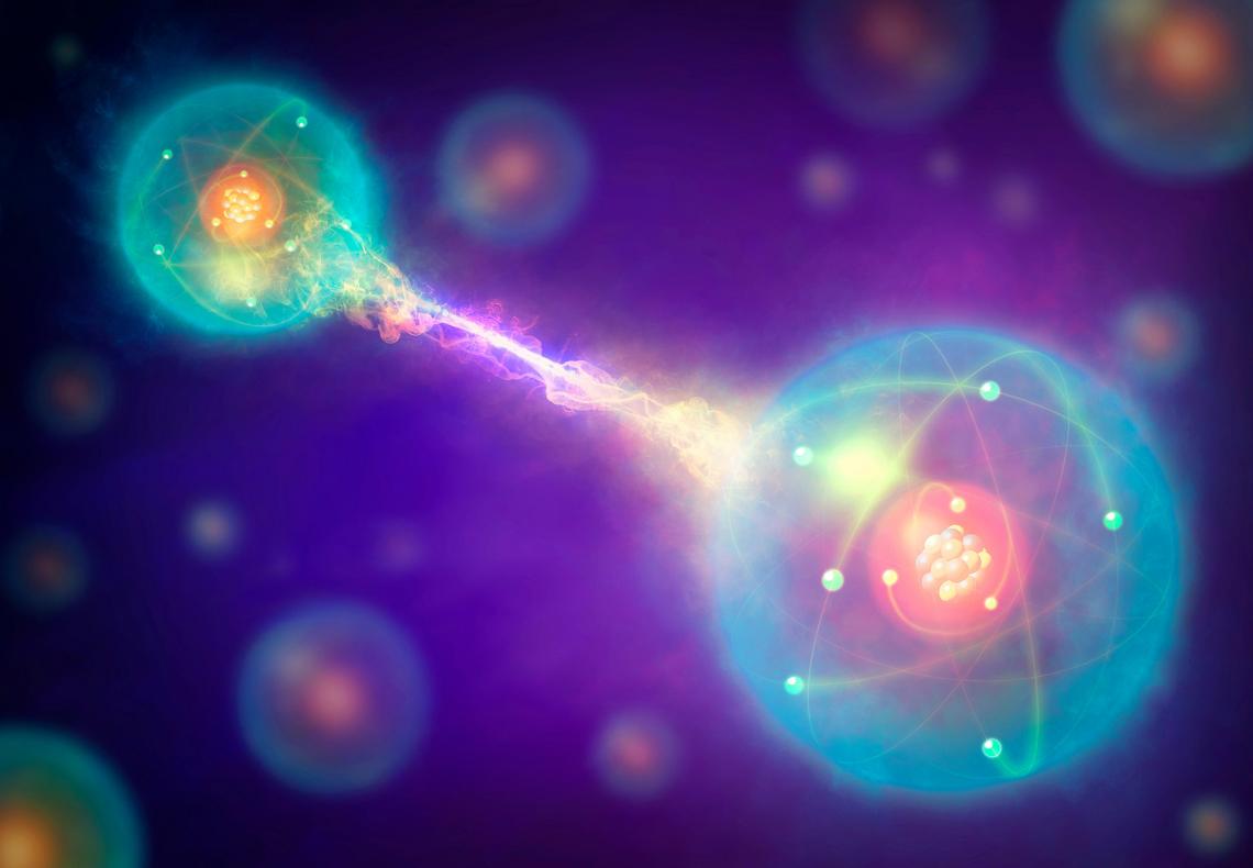 Conceptual artwork of a pair of entangled quantum particles interacting. 