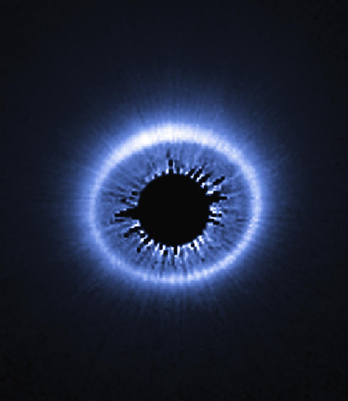Located 169 light-years from Earth, circumstellar disk HD 181327 is seen nearly face-on. The image, taken with the Hubble Space Telescope, reveals a vast disk of dust and debris around the central star whose light has been blocked out so that the very fai Located 169 light-years from Earth, circumstellar disk HD 181327 is seen nearly face-on. The image, taken with the Hubble Space Telescope, reveals a vast disk of dust and debris around the central star, whose light has been blocked out so that the very fa