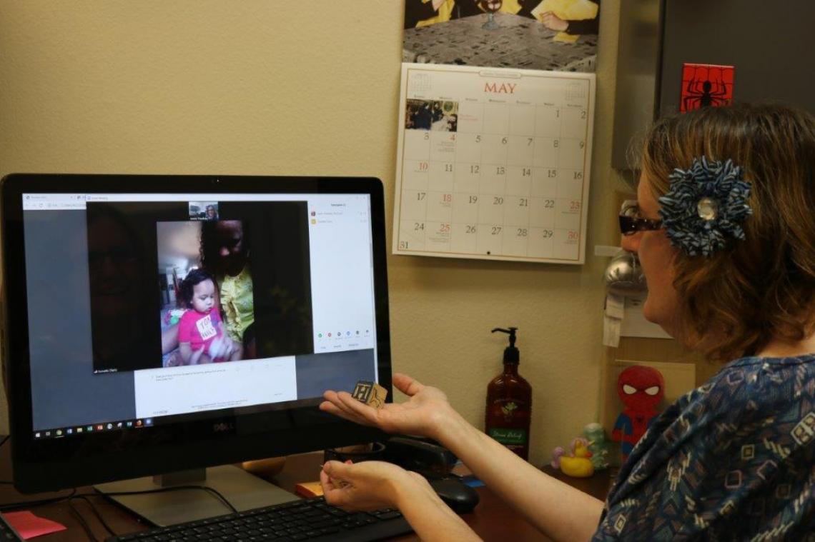 Jennie Treadway, a program coordinator in the Pinal County Cooperative Extension office, completes a screening with Sonnetta Cherry and her son Luis. Jennie Treadway, a program coordinator in the Pinal County Cooperative Extension office, completes a screening with Sonnetta Cherry and her son Luis.