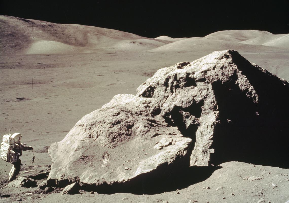 In this Apollo 17 onboard photo, scientist and astronaut Harrison H. Schmitt collects rock samples from a huge boulder near the Valley of Tourus-Littrow on the lunar surface. In this Apollo 17 onboard photo, scientist and astronaut Harrison H. Schmitt collects rock samples from a huge boulder near the Valley of Tourus-Littrow on the lunar surface.