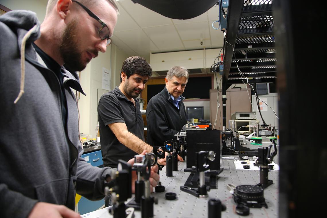 From left: Doctoral student Joshua Olsen, postdoctoral researcher Veyesi Demir, and professor and inventor Nasser Peyghambarian. From left: Doctoral student Joshua Olsen, postdoctoral researcher Veyesi Demir, and professor and inventor Nasser Peyghambarian.