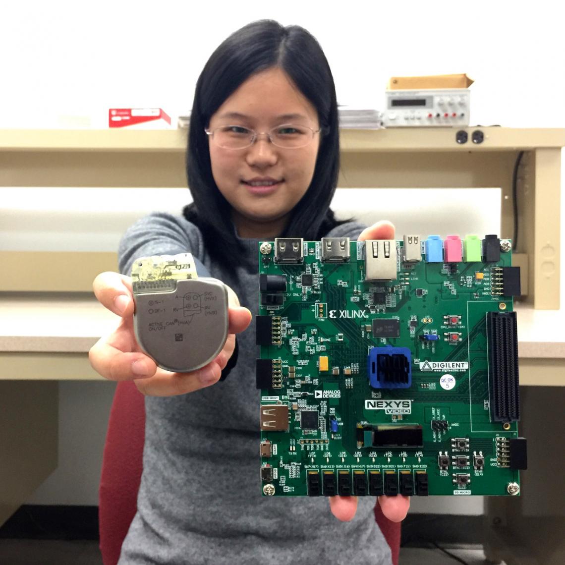 UA doctoral student Sixing Lu is helping associate professor Roman Lysecky develop technology on a prototype network-connected pacemaker to detect hacking of a real pacemaker .
UA doctoral student Sixing Lu is helping associate professor Roman Lysecky develop technology on a prototype network-connected pacemaker to detect hacking of a real pacemaker .