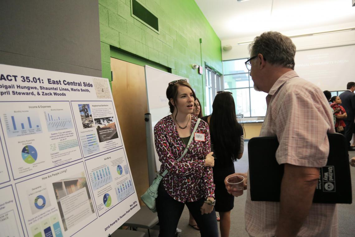 Shauntel Lines explains the project to a community member. Shauntel Lines explains the project to a community member.
