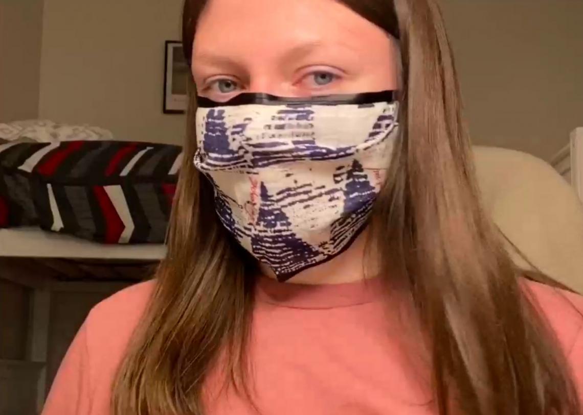 Brittany Faubel in the College of Agriculture and Life Sciences used a reusable shopping bag and ribbon to craft a mask. Brittany Faubel in the College of Agriculture and Life Sciences used a reusable shopping bag and ribbon to craft a mask.