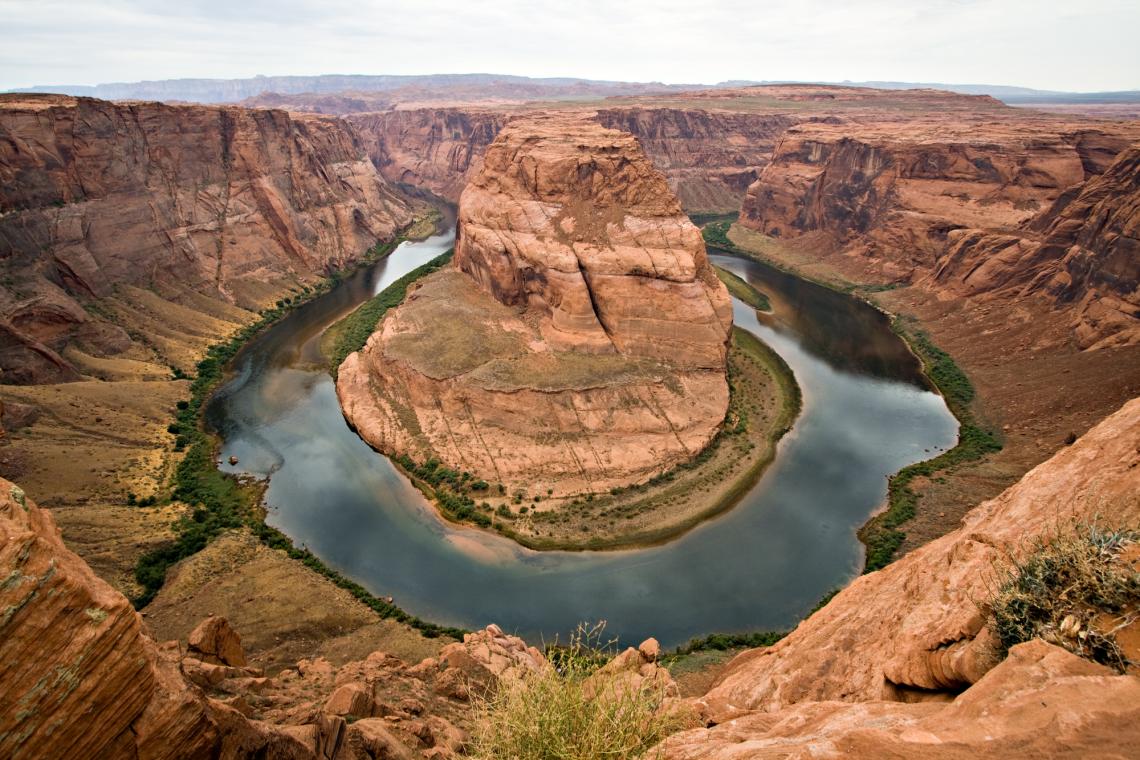 Horseshoe Bend is a horseshoe-shaped meander of the Colorado River located near the town of Page, Arizona. Horseshoe Bend is a horseshoe-shaped meander of the Colorado River located near the town of Page, Arizona.