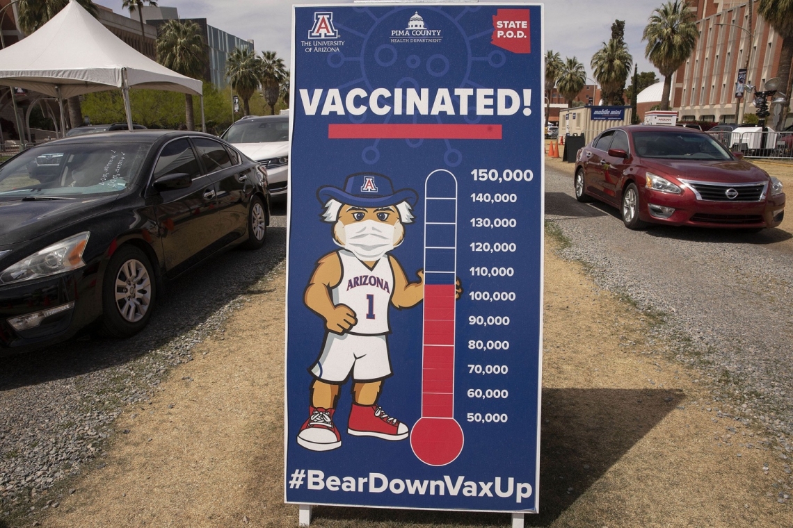 thermometer showing over 100,000 people vaccinated