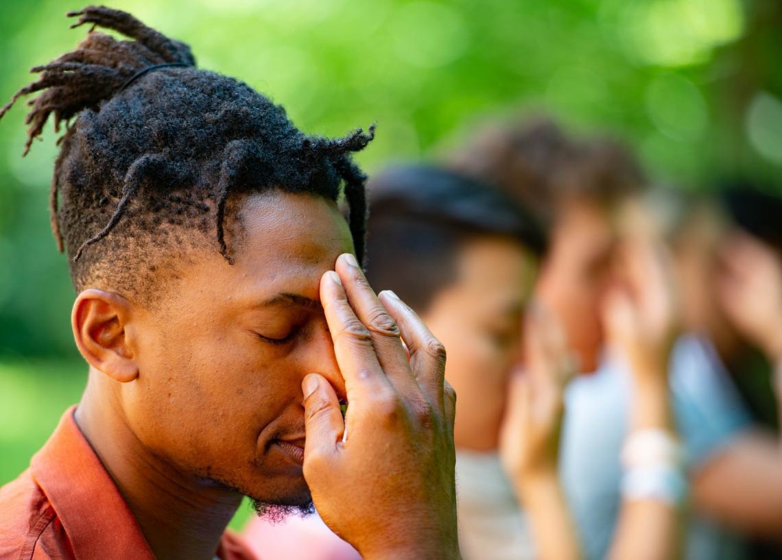 A person practicing a breathing exercise