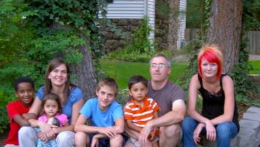 Brewer and his family shortly after he was adopted. Brewer and his family shortly after he was adopted.