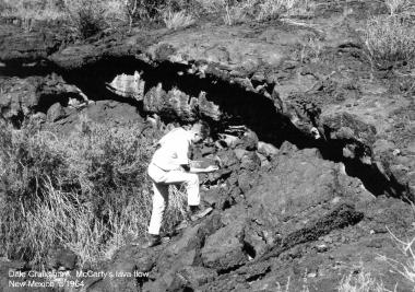 Dale Cruikshank, who studied under Kuiper as a graduate student, crawls among McCarty's Lava Flow Field in New Mexico c. 1964. 