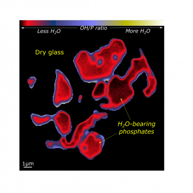 A NanoSIMS isotope ratio image showing water-bearing minerals in a sea of water-poor glass in Apollo sample 10049. These were the last phases to crystallize from the lava as it cooled on the surface of the Moon. The scale bar on the lower left measures A NanoSIMS isotope ratio image showing water-bearing minerals in a sea of water-poor glass in Apollo sample 10049. These were the last phases to crystallize from the lava as it cooled on the surface of the Moon. The scale bar on the lower left measures